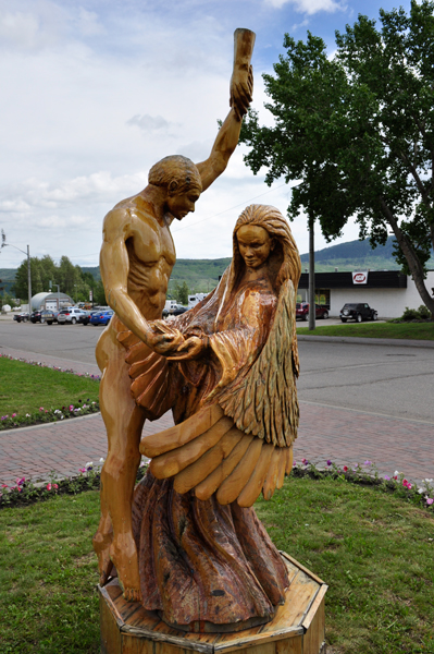 a naked man dancing with an angel.